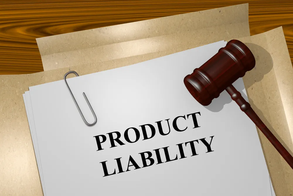 Papers and a gavel with the words "product liability" in type face.