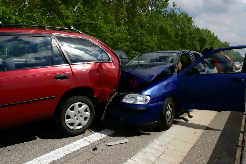 blue car re ended into a red car.