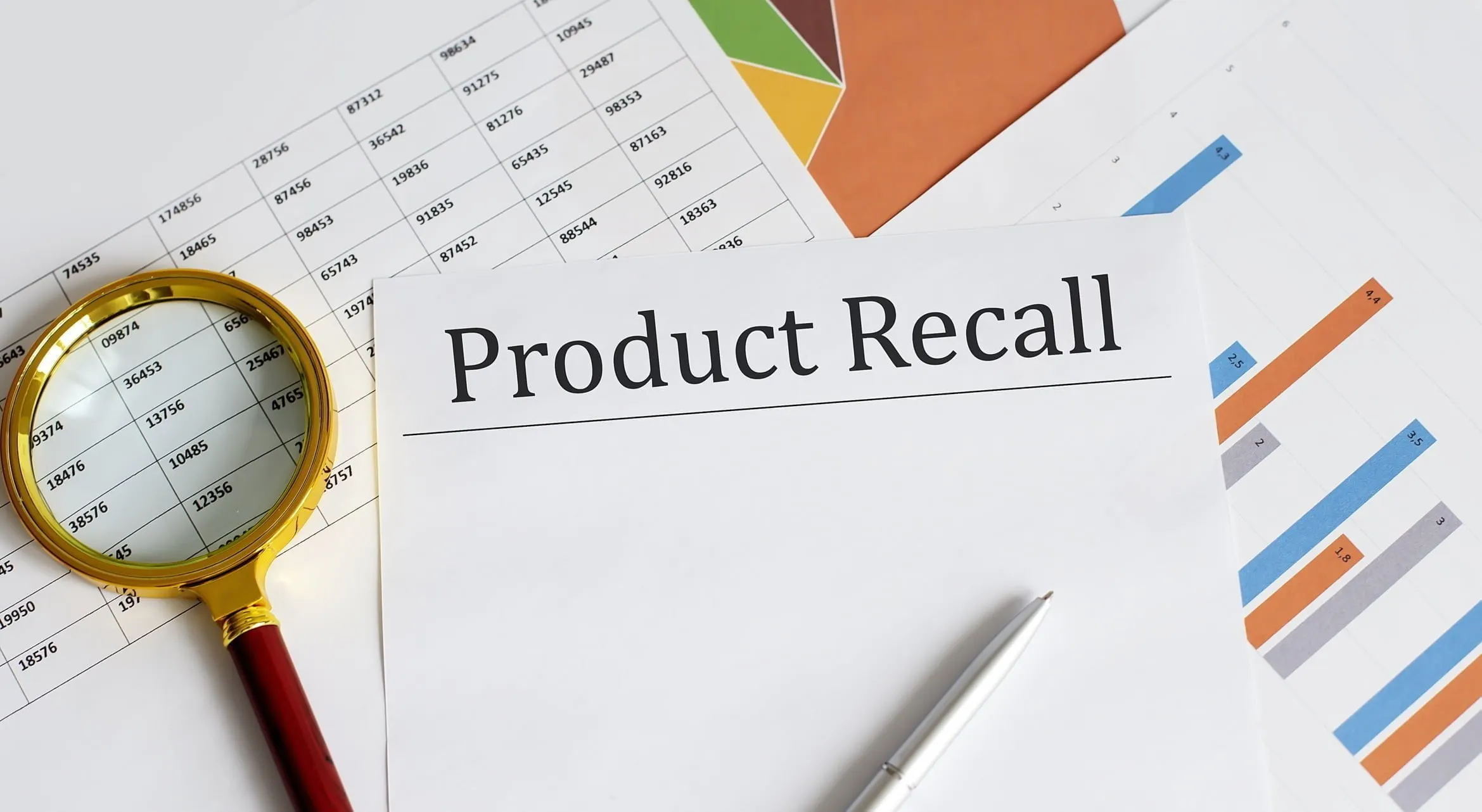 Reports, magnifying glass, pen, and paper reading “Product Recall” on table. If you’ve been injured by a product, our team of Wyoming product liability lawyers is ready to fight for you. 