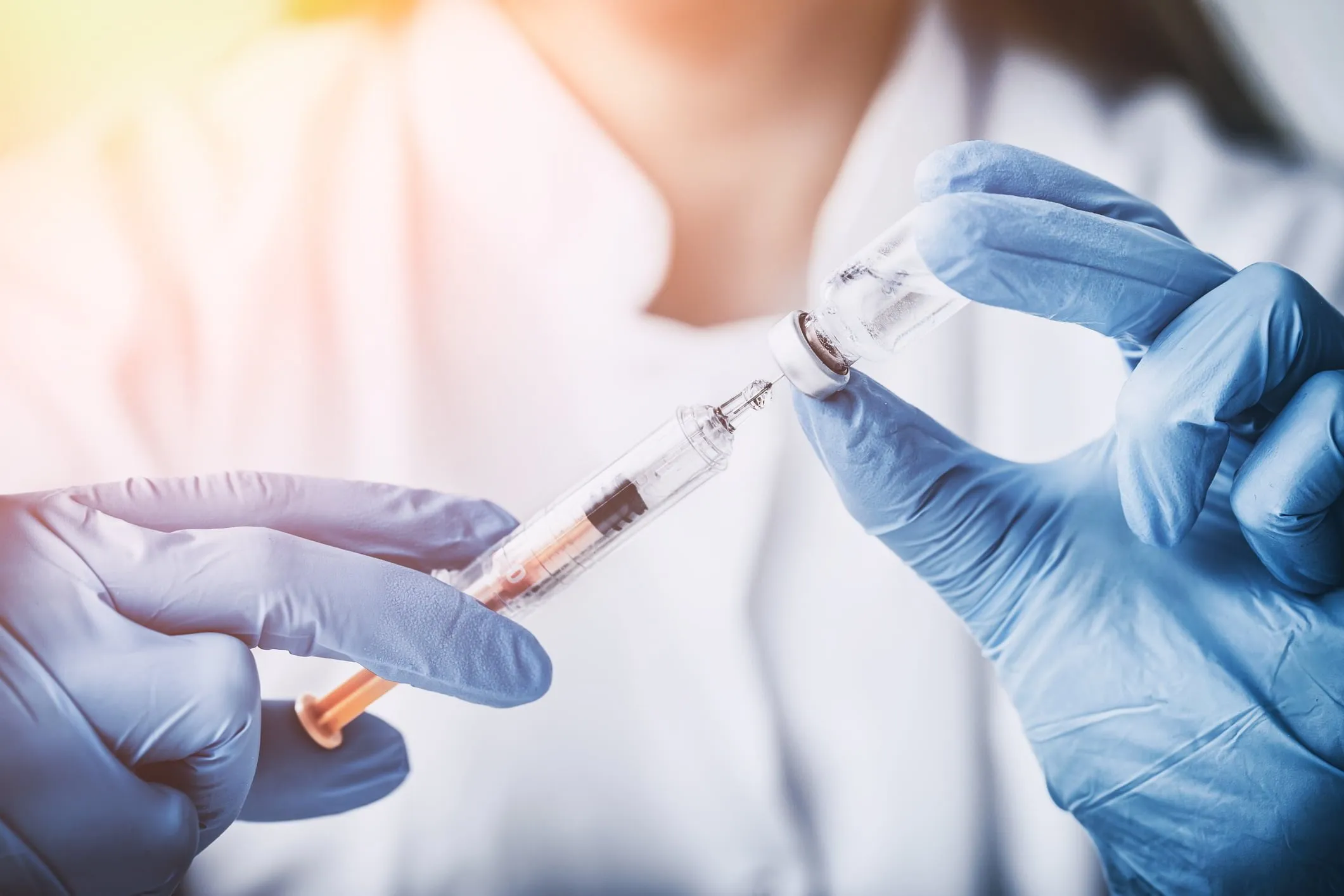 Close-up view of a doctor preparing a syringe of medicine. Our defective drug lawyers fight for those whose lives have been negatively impacted due to defective or dangerous prescription drugs. 